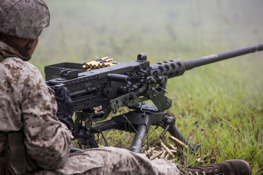 A Marine with 2nd Air Naval Gunfire Liaison Company fires the M2 .50 Caliber Heavy Machine Gun during a week-long field exercise at Camp Lejeune, N.C., Aug. 27, 2015. The Marines were conducting this training in order to uphold their readiness and standards in support of II Marine Expeditionary Force and to re-familiarize themselves with the weapons system. (U.S. Marine Corps photo by Cpl. Krista James/Released)