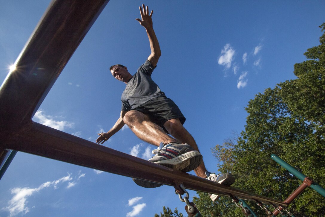New Jersey Air National Guard Tech. Sgt. Justin B. Gielski trains for “American Ninja Warrior” at a playground near his home in Medford, N.J., Aug. 21, 2015. New Jersey Air National Guard photo by Master Sgt. Mark C. Olsen