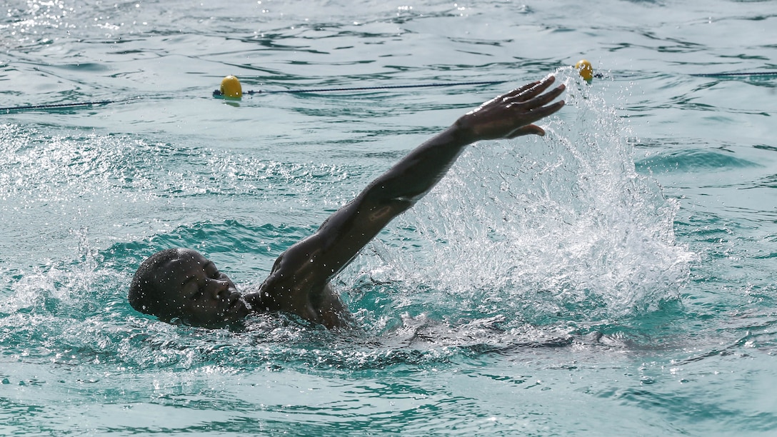 A Compagnie Fusilier de Marin Commando demonstrates his swimming technique during a swim assessment by personnel with Special-Purpose Marine Air-Ground Task Force Crisis Response-Africa, during a swim assessment in Dakar, Senegal, Aug. 28, 2015. The assessment was conducted to ensure the COFUMACO are capable and confident in the water before they conduct small-boat operations  training together in the following weeks. 