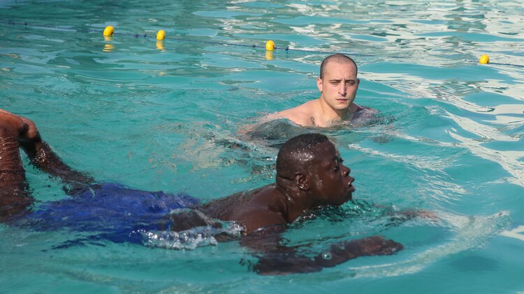 Cpl. Matt Sprankle, a Marine Corps Instructor of Water Survival with Special-Purpose Marine Air-Ground Task Force Crisis Response-Africa, evaluates a Compagnie Fusilier de Marin Commando’s technique during a swim assessment in Dakar, Senegal, Aug. 27, 2015. The Marines and Coast Guardsmen with the team wanted to ensure the COFUMACO had basic swim knowledge and abilities before the partner nations begin small-boat operations in the following weeks. 