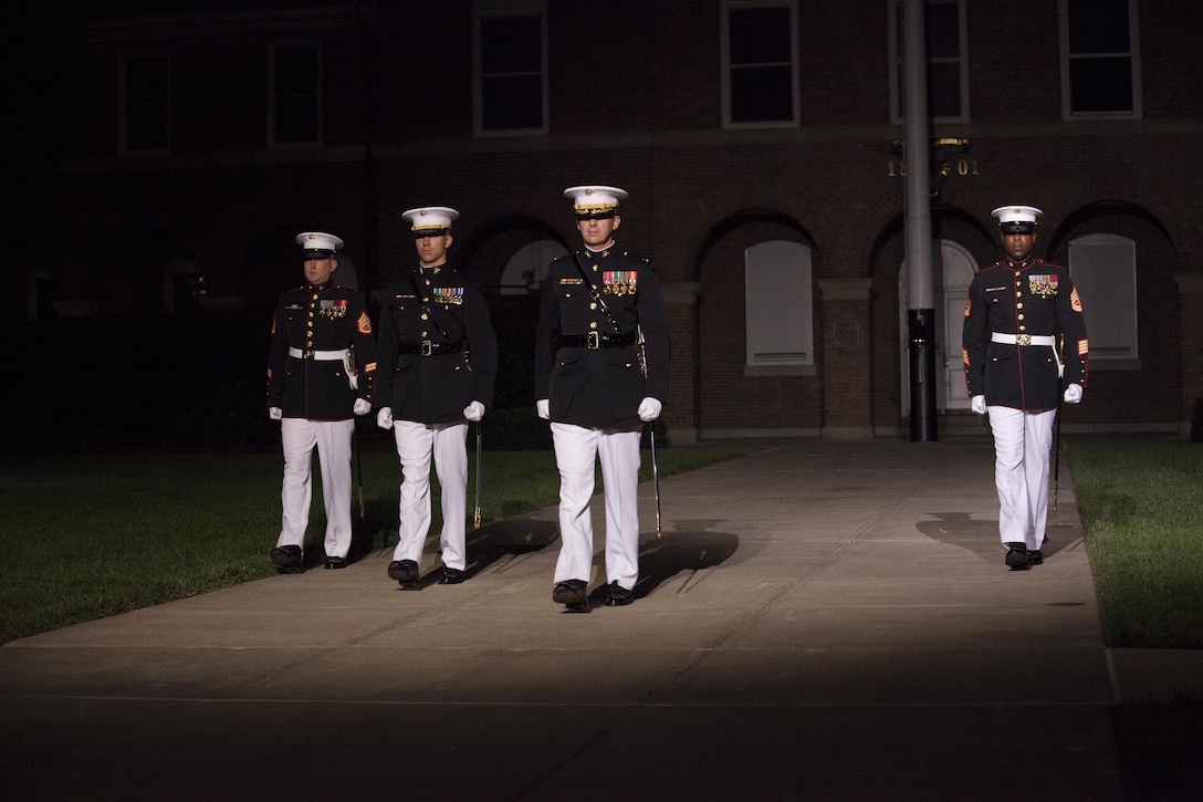U.S. Marines with Marine Barracks Washington, D.C., march during an evening parade, Aug, 28, 2015. U.S. Marines Sgt. Jonathan W. Patrick and Lance Cpl. Kyle F. McDonald were the guests of honor for the parade and Gen. Joseph F. Dunford Jr., 36th commandant of the Marine Corps, was the hosting official for that same parade. The Evening Parade summer tradition began in 1934 and features the Silent Drill Platoon, the Marine Band, the U.S. Marine Drum and Bugle Corps and two marching companies. More than 3,500 guests attend the parade every week. (U.S. Marine Corps photo by Lance Cpl. Alejandro Sierras/ Released)