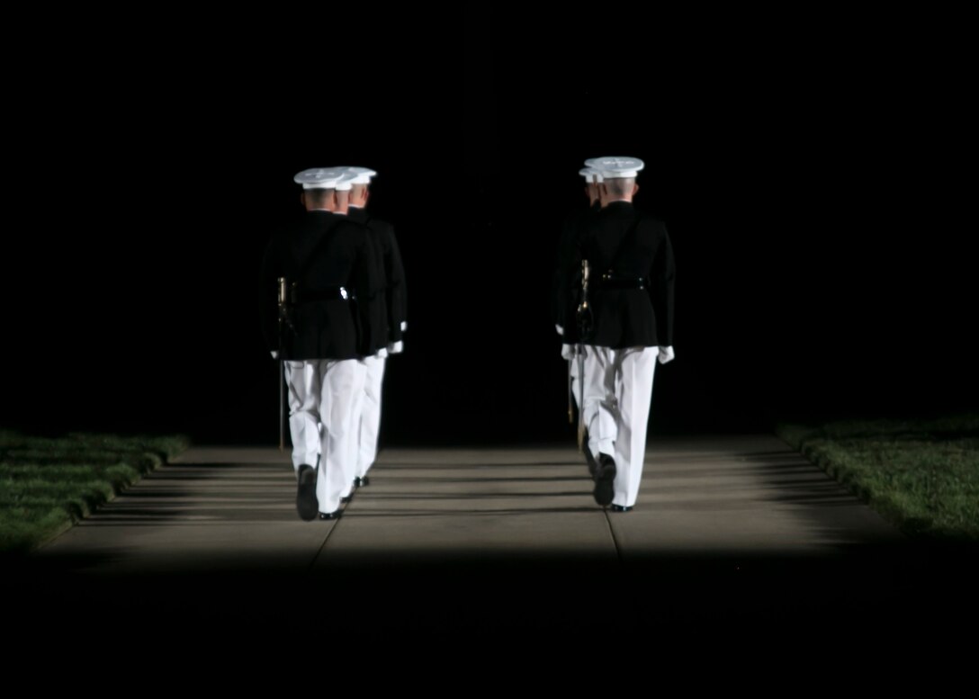 Marines with Marine Barracks Washington, D.C., perform during a Friday Evening Parade at Marine Barracks Washington, D.C., Aug. 28, 2015. Two Marine Barracks Washington Marines, Sgt. Jonathan W. Patrick, Alpha Company, and Lance Cpl. Kyle F. McDonald, Guard Company, were the guests of honor for the parade and Gen. Joseph F. Dunford Jr., 36th commandant of the Marine Corps, was the hosting official. (U.S. Marine Corps photo by Cpl. Christian Varney/Released)