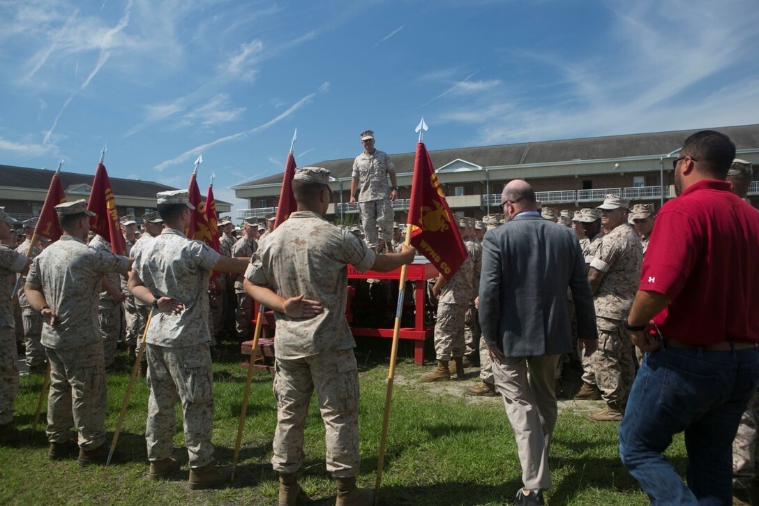 Ret. Gunnery Sgt. Glen Silva, second from right, makes his way to give a speech during a ceremony to commemorate his dedicated service to his country and Corps, Aug. 28, 2015. Silva, formerly an infantry platoon sergeant, will have an award named after him awarded to staff-noncommissioned officers who are models of courage and performance within their field of expertise called the “GySgt. Glen Silva Staff NCO Award of Excellence.”