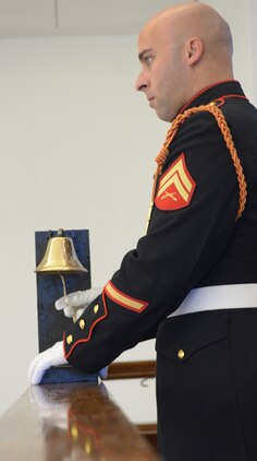 Brad Mamalis, a former Marine who played soprano bugler for the Commandant's Own Drum & Bugle Corps rings a bell after the name of each of the 567 Marines and Corpsman who were killed in action with 1st Battalion, 1st Marines in Vietnam from 1965-1971. As the roll call was part of ceremony dedicating a new memorial was held aboard Marine Corps Base Quantico Aug. 29. The new memorial displays each of the 567 names and is located at the National Museum of the Marine Corps.