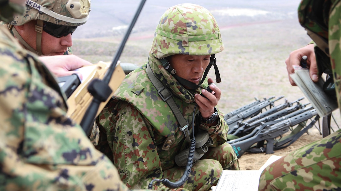 A Japanese soldier calls in naval gunfire during a combined arms shoot with naval gunfire, attack rotary aircraft and 120mm mortars at San Clemente Island, California, Sept. 1, 2015. Exercise Dawn Blitz 2015 at San Clemente Island, California, September 1.  Marines with 3rd Air Naval Gunfire Liaison Company and Japanese soldiers conducted the live-fire shoot as part of Exercise Dawn Blitz 2015. Dawn Blitz is a multinational training exercise designed to enhance Expeditionary Strike Group Three and 1st Marine Expeditionary Brigade’s ability to conduct sea-basing operations, amphibious landings, and command and control capabilities alongside Japan, Mexico and New Zealand.