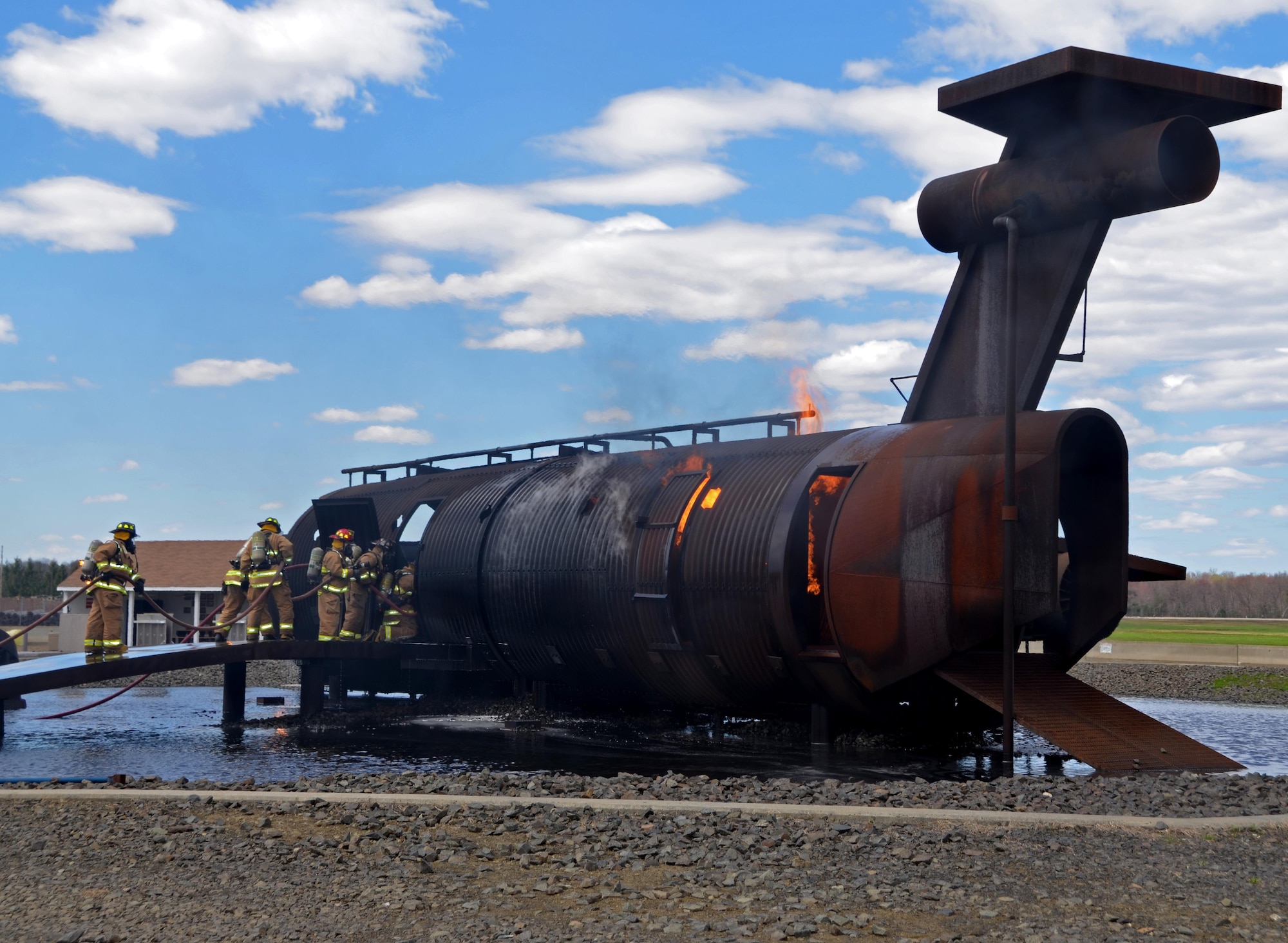 Westover firefighters face the flames as they enter the fire training simulator on base.