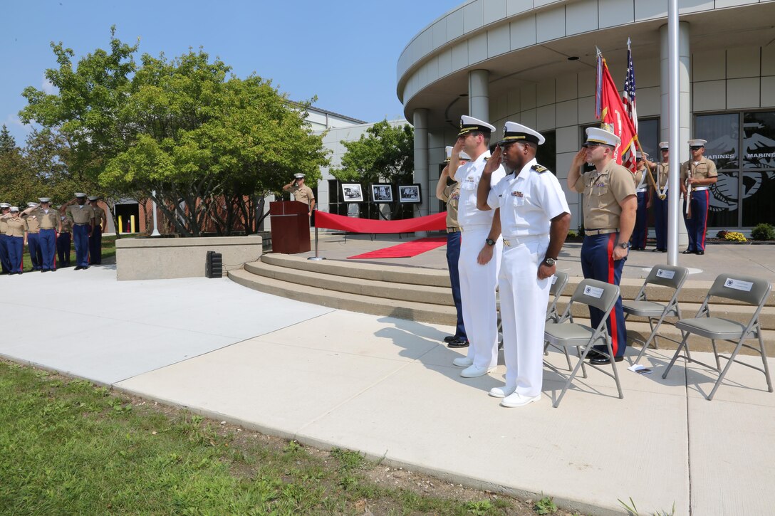 NAVAL STATION GREAT LAKES -- Marines and sailors stationed aboard Naval Station Great Lakes celebrate the official opening of the 9th Marine Corps District's headquarters building, Sept. 1, 2015. The ceremony also commemorated the 78th anniversary of the unit's activation as 9th Reserve District, which was established aboard the Naval Station, Sept. 1, 1937. Col. Jason Morris, the District's commanding officer, spoke during the ceremony about the importance of recruiting and how maintaining a well-qualified, well-trained Marine Corps begins with the individual recruiter on the streets. The District is responsible for recruiting enlisted, officer and prior service Marines across 660,000 square miles and 13 states in the Midwest region. 