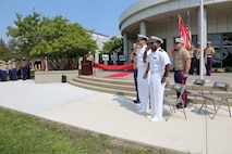 NAVAL STATION GREAT LAKES -- Marines and sailors stationed aboard Naval Station Great Lakes celebrate the official opening of the 9th Marine Corps District's headquarters building, Sept. 1, 2015. The ceremony also commemorated the 78th anniversary of the unit's activation as 9th Reserve District, which was established aboard the Naval Station, Sept. 1, 1937. Col. Jason Morris, the District's commanding officer, spoke during the ceremony about the importance of recruiting and how maintaining a well-qualified, well-trained Marine Corps begins with the individual recruiter on the streets. The District is responsible for recruiting enlisted, officer and prior service Marines across 660,000 square miles and 13 states in the Midwest region. 