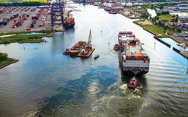 A container ship navigates the Arthur Kill Channel between the New York Container Terminal Staten Island, N.Y. and Elizabeth, N.J. Deepening the Arthur Kill Channel included the removal of both soft material for beneficial upland disposal and hard rock material. The AK 3 contract deepening involved the removal of approximately 1.1 million cubic yards of rock that were disposed of at an offshore artificial reef site. 