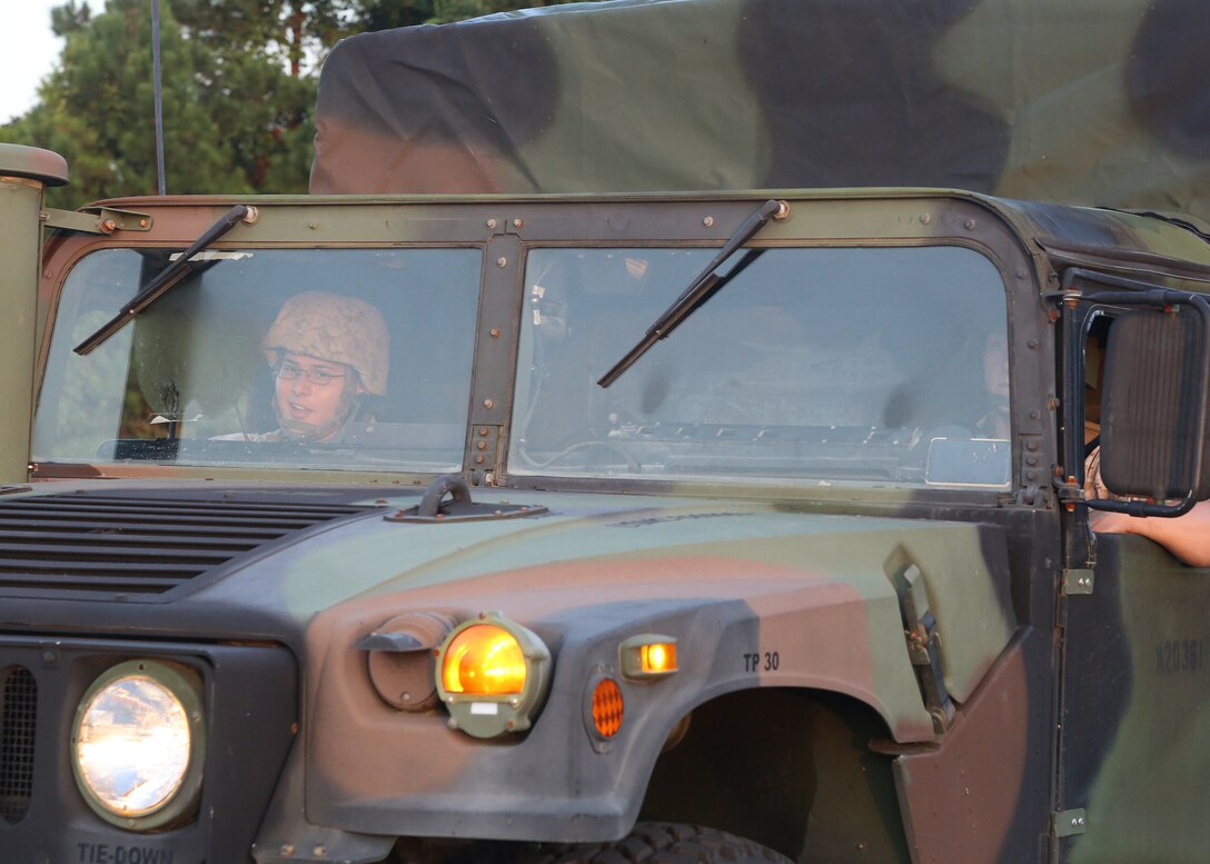 U.S. Marines with the 22nd Marine Expeditionary Unit (MEU) command element drive a safety vehicle during a 5-mile conditioning hike at Marine Corps Base Camp Lejeune, N.C., Aug. 21, 2015. The hike gave the MEU command element an opportunity to build comradery and prepare for future hikes of greater distance and heavier loads. (U.S. Marine Corps photo by Gunnery Sgt. Matt Epright/Released)