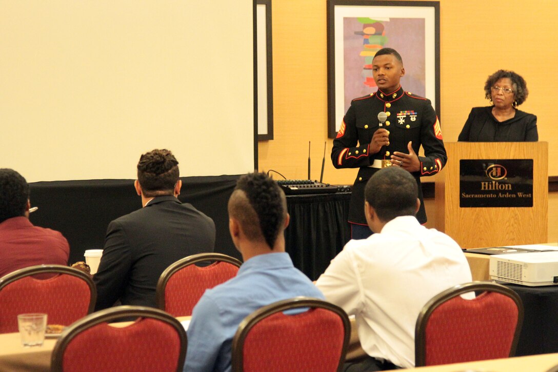 SACRAMENTO – Sgt. Reuben Smith, IV, officer selection assistant, Recruiting Station Sacramento, introduces himself to the audience at the Ron Brown Business and Economic Summit here, Aug. 29, 2015. The California Black Chamber of Commerce hosted a youth summit at the event to teach local youths about leadership and business skills. The participants formulated business plans and presented to a panel, who critiques and advised them.
(U.S. Marine Corps photo by Staff Sgt. Jacob Harrer)
