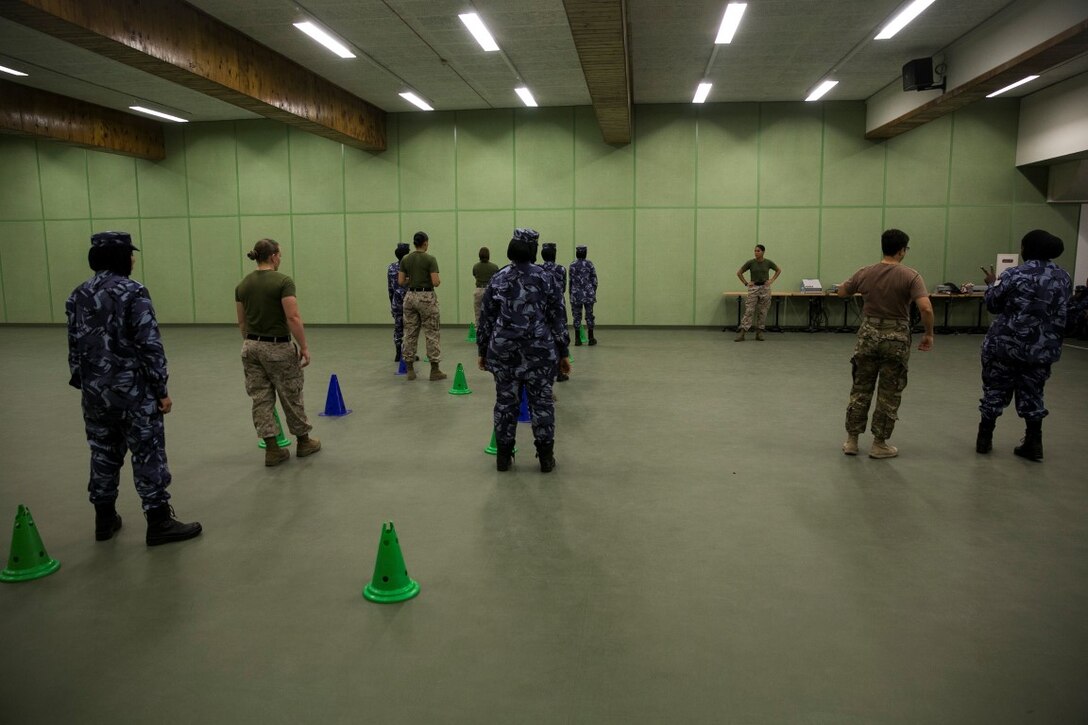 QATAR (Aug 18, 2015) 
U.S. military personnel with the Female Partner Force Engagement Team demonstrate motorcade operations during a subject matter expert exchange with the Qatari Internal Security Forces Female VIP Protection Unit in Qatar. The FPFET was comprised of U.S. Marines with the 15th Marine Expeditionary Unit as well as Soldiers and Sailors with Special Operations Command Central-Forward and Joint Special Operations Task Force-Arabian Peninsula. During the SMEE they covered medical care, marksmanship, and personal security detail strategies. (U.S. Marine Corps photo by Cpl. Anna Albrecht/Released)