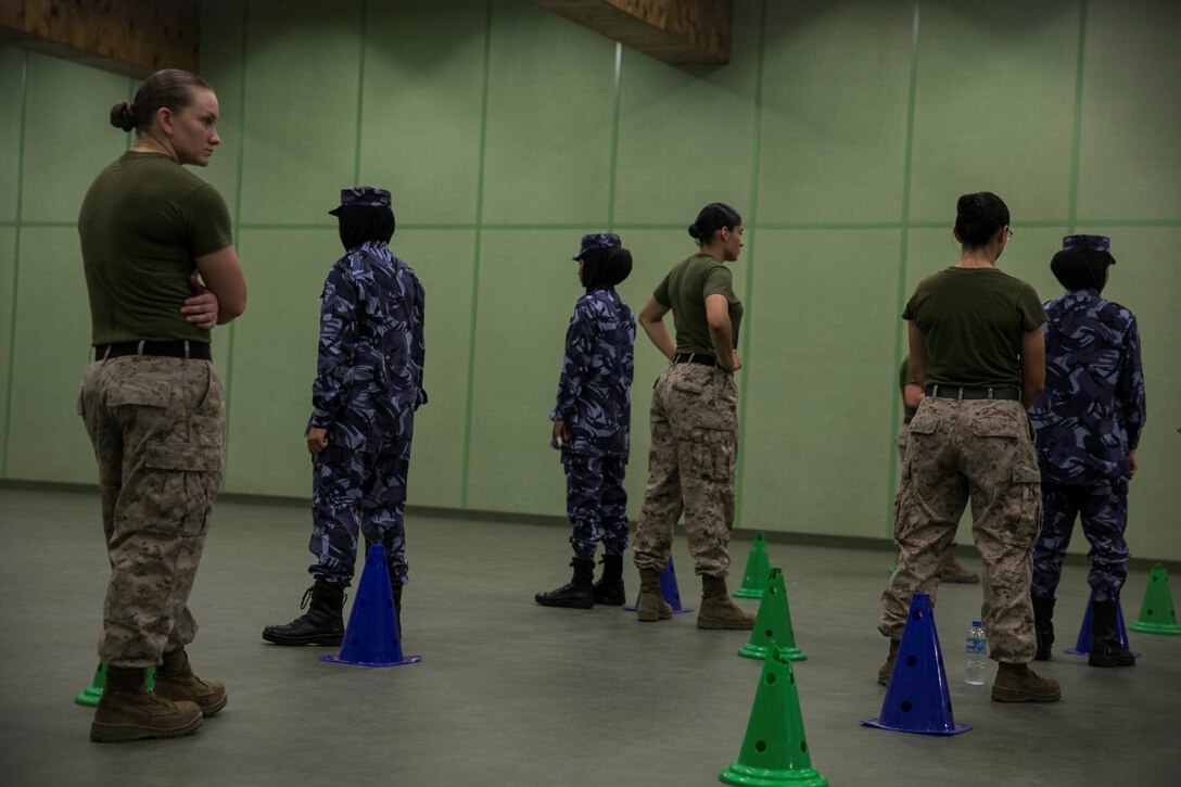 QATAR (Aug 18, 2015)
U.S. Marines with the Female Partner Force Engagement Team demonstrate motorcade operations during a subject matter expert exchange with the Qatari Internal Security Forces Female VIP Protection Unit in Qatar. The FPFET was comprised of U.S. Marines with the 15th Marine Expeditionary Unit as well as Soldiers and Sailors with Special Operations Command Central-Forward and Joint Special Operations Task Force-Arabian Peninsula. During the SMEE they covered medical care, marksmanship, and personal security detail strategies. (U.S. Marine Corps photo by Cpl. Anna Albrecht/ Released)