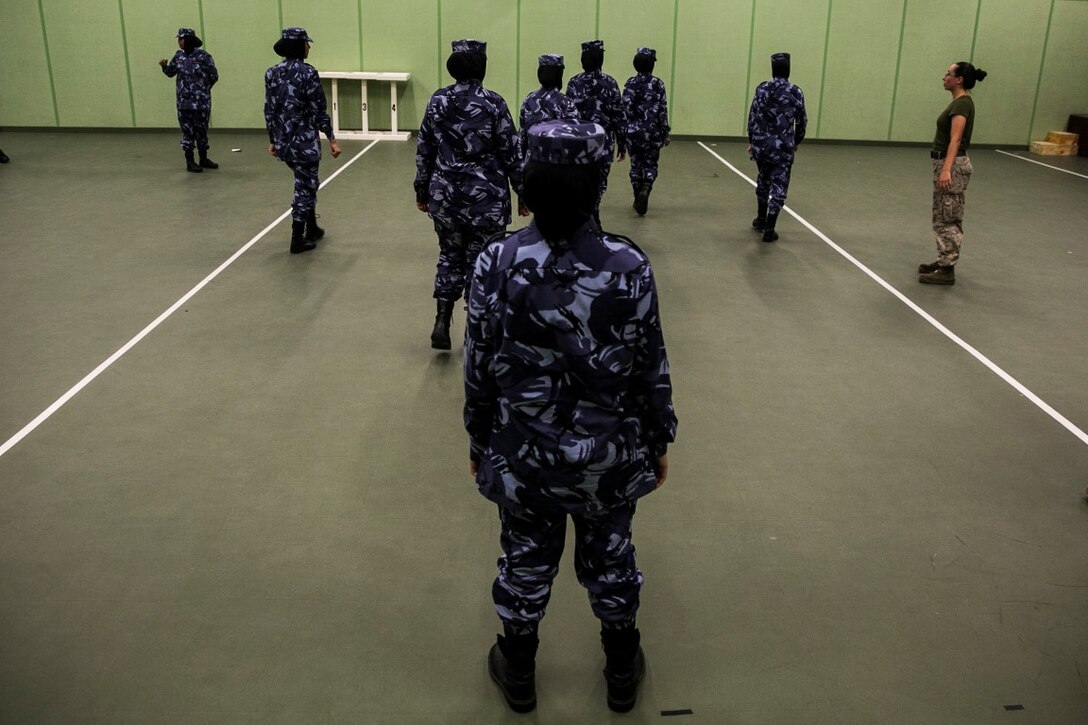 QATAR (Aug 18, 2015)
Female with the Qatari Internal Security Forces VIP protection division demonstrate how they execute motorcade operations while partaking in a Subject Matter Expert Exchange with the Qatari Internal Security Forces Female VIP Protection Unit in Qatar. The FPFET was comprised of U.S. Marines with the 15th Marine Expeditionary Unit as well as Soldiers and Sailors with Special Operations Command Central-Forward and Joint Special Operations Task Force-Arabian Peninsula. During the SMEE they covered medical care, marksmanship, and personal security detail strategies. (U.S. Marine Corps photo by Cpl. Anna Albrecht/ Released)