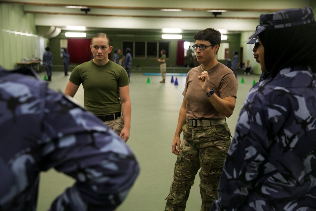 QATAR (Aug 18, 2015)
U.S. military personnel with the Female Partner Force Engagement Team explain motorcade operations during a subject matter expert exchange with the Qatari Internal Security Forces Female VIP Protection Unit in Qatar. The FPFET was comprised of U.S. Marines with the 15th Marine Expeditionary Unit as well as Soldiers and Sailors with Special Operations Command Central-Forward and Joint Special Operations Task Force-Arabian Peninsula. During the SMEE they covered medical care, marksmanship, and personal security detail strategies. (U.S. Marine Corps photo by Cpl. Anna Albrecht/Released)