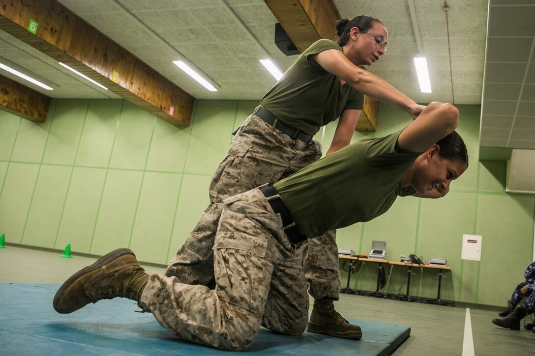 QATAR (Aug 18, 2015)
U.S. Marines Lance Cpl. Chevon Ferrel, left, and Cpl. Justine Woodend demonstrate searching techniques during a subject matter expert exchange with the Qatari Internal Security Forces Female VIP Protection Unit in Qatar. Ferrel is an ammunition technician and Woodend is a motor transportation operator with the 15th Marine Expeditionary. They are members of the Female Partner Force Engagement Team. The FPFET was comprised of U.S. Marines with the 15th MEU as well as Soldiers and Sailors with Special Operations Command Central-Forward and Joint Special Operations Task Force-Arabian Peninsula. During the SMEE they covered medical care, marksmanship, and personal security detail strategies. (U.S. Marine Corps photo by Cpl. Anna Albrecht/Released)