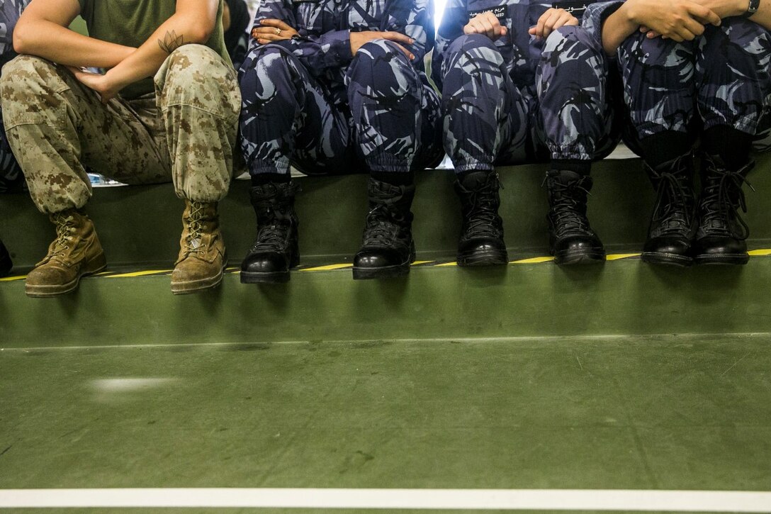 QATAR (AUG. 19, 2015)
A U.S. Marine with the 15th Marine Expeditionary Unit sits alongside members of the Qatari Internal Security Forces Female VIP Protection Unit during a subject matter expert exchange in Qatar. 15th MEU Marines worked with Soldiers and Sailors with Special Operations Command Central-Forward and Joint Special Operations Task Force-Arabian Peninsula to make up the Female Partner Force Engagement Team. During the SMEE they covered medical care, marksmanship, and personal security detail strategies. (U.S. Marine Corps photo by Cpl. Anna Albrecht/Released)