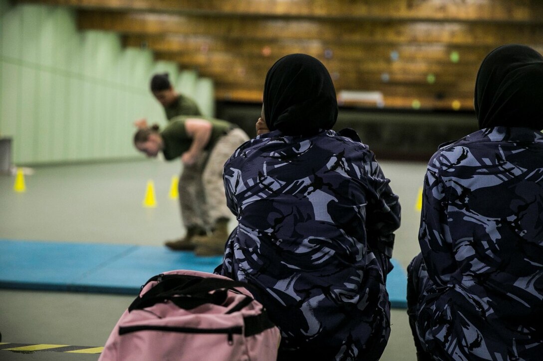 QATAR (AUG. 19, 2015) U.S. Marines with the Female Partner Force Engagement Team demonstrate Marine Corps Martial Arts Program during a subject matter expert exchange with the Qatari Internal Security Forces Female VIP Protection Unit in Qatar. The FPFET was comprised of U.S. Marines with the 15th Marine Expeditionary Unit as well as Soldiers and Sailors with Special Operations Command Central-Forward and Joint Special Operations Task Force-Arabian Peninsula. During the SMEE they covered medical care, marksmanship, and personal security detail strategies. (U.S. Marine Corps photo by Cpl. Anna Albrecht/Released)