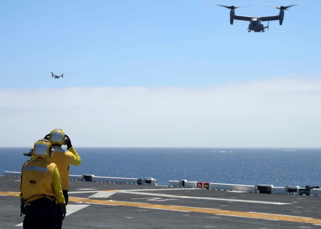 150831-N-GZ228-007 PACIFIC OCEAN (August 31, 2015) Air Department Sailors signal to an MV-22 Osprey, attached to Marine Medium Tiltrotor Squadron (VMM) 163, as it prepares to land on the flight deck of the amphibious assault ship USS Boxer (LHD 4). Boxer is currently underway off the coast of southern California participating in Dawn Blitz 2015 (DB-15).  DB-15 is a multinational training exercise being conducted by Expeditionary Strike Group 3 (ESG-3) and 1st Marine Expeditionary Brigade (1st MEB) to build U.S., Japan, Mexico and New Zealand’s amphibious, and command and control capabilities through live, simulated, and constructive military training activities. (U.S. Navy photo by Mass Communication Specialist 3rd Class Jesse Monford/Released)
