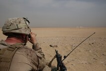 U.S. Marine Sgt. Danny Holzworth, a Joint Terminal Attack Controller, with the Special Purpose Marine Air Ground Task Force—Crisis Response—Central Command observes an impact of an artillery strike during a Fire Support Coordination Exercise (FSCEX)  in an undisclosed location in Southwest Asia, Aug. 25, 2015. The FSCEX is a SPMAGTF and 15th Marine Expeditionary Unit combined arms exercise designed to promote interoperability between the two Marine Corps contingency response forces in the Central Command Area of Operations. (U.S. Marine Corps photo by Cpl. Jonathan Boynes)