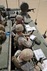 A Fire Support Team (FiST) from Battalion Landing Team 3rd Battalion, 1st Marine Regiment, 15th Marine Expeditionary Unit, identify and call in artillery strikes during a Fire Support Coordination Exercise (FSCEX) in an undisclosed location in Southwest Asia Aug. 25, 2015. The FSCEX is a SPMAGTF and 15th Marine Expeditionary Unit combined arms exercise designed to promote interoperability between the two Marine Corps contingency response forces in the Central Command Area of Operations. BLT 3/1, 15th MEU’s ground combat element, is embarked on the Essex Amphibious Ready Group and deployed to maintain regional security in the U.S. 5th Fleet area of operations. (U.S. Marine Corps photo by Cpl. Jonathan Boynes)
