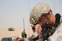 A Fire Support Team (FiST) from Battalion Landing Team 3rd Battalion, 1st Marine Regiment, 15th Marine Expeditionary Unit, call in mortar strikes during a Fire Support Team Exercise (FSCex) in an undisclosed location in Southwest Asia, Aug. 25, 2015. The FSCEX is a SPMAGTF and 15th Marine Expeditionary Unit combined arms exercise designed to promote interoperability between the two Marine Corps contingency response forces in the Central Command Area of Operations.  The 15th MEU is embarked aboard the ships of the Essex Amphibious Ready Group and deployed to maintain regional security in the U.S. 5th Fleet area of operations.  (U.S. Marine Corps photo by Cpl. Jonathan Boynes)