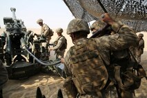 Artillery Marines with India Battery, Battalion Landing Team 3rd Battalion, 1st Marine Regiment, 15th Marine Expeditionary Unit, load a M777 Howitzer during a Fire Support Coordination Exercise (FSCEX) in an undisclosed location in Southwest Asia, Aug. 25, 2015.  The FSCEX is a SPMAGTF and 15th Marine Expeditionary Unit combined arms exercise designed to promote interoperability between the two Marine Corps contingency response forces in the Central Command Area of Operations. BLT 3/1, 15th MEU’s ground combat element, is embarked on the Essex Amphibious Ready Group and deployed to maintain regional security in the U.S. 5th Fleet area of operations.  (U.S. Marine Corps photo by Cpl. Jonathan Boynes)
