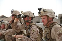 1stLt Hayden Lawson looks on as a Company Fire Support Team (FiST) with Special Purpose Marine Air Ground Task Force—Crisis Response—Central Command identify targets and call in mortar strikes during a Fire Support Coordination Exercise (FSCEX) in an undisclosed location in Southwest Asia, Aug. 25, 2015. The FSCEX is a SPMAGTF and 15th Marine Expeditionary Unit combined arms exercise designed to promote interoperability between the two Marine Corps contingency response forces in the Central Command Area of Operations. (U.S. Marine Corps photo by Cpl. Jonathan Boynes)