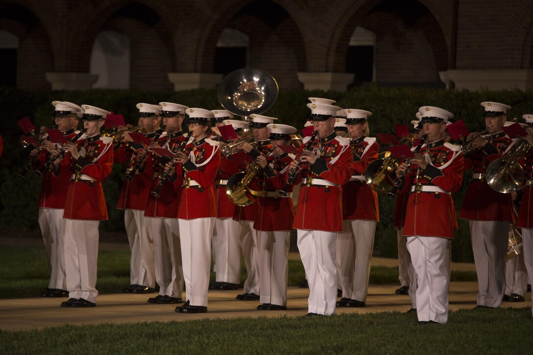 The United States Marine Band performs during a Friday Evening Parade at Marine Barracks Washington, D.C., Aug. 28, 2015. Two Marine Barracks Washington Marines, Sgt. Jonathan W. Patrick, Alpha Company, and Lance Cpl. Kyle F. McDonald, Guard Company, were the guests of honor for the parade and Gen. Joseph F. Dunford Jr., 36th commandant of the Marine Corps, was the hosting official. (U.S. Marine Corps photo by Cpl. Skye Davis/Released)
