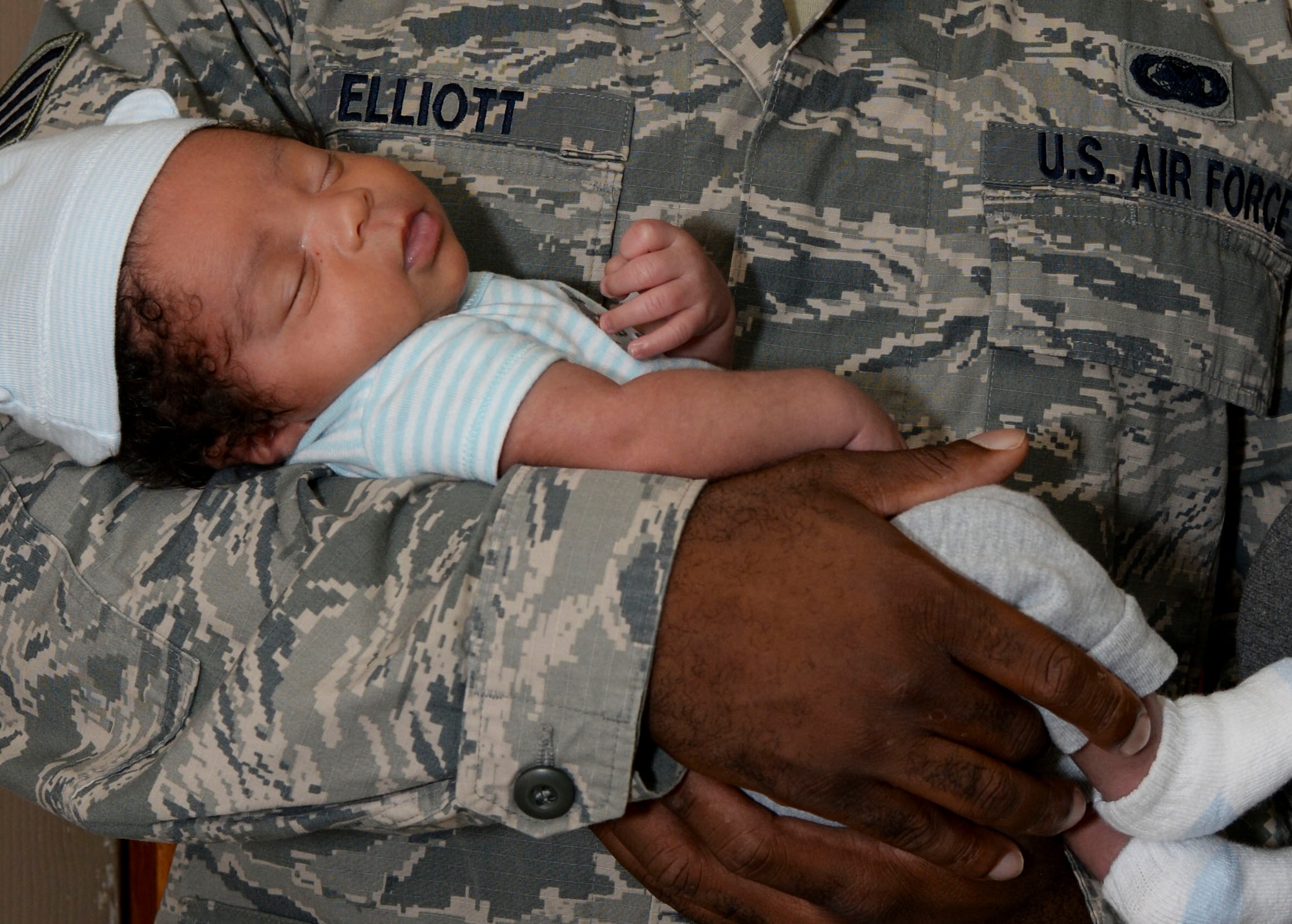 Darryal Elliott III rests in his father’s arms at Barksdale Air Force Base, La., Aug. 26, 2015. Darryal Elliott III surprised his parents, Staff Sgt. Darryal Elliott Jr., 2nd Logistics Readiness Squadron fuels mobile distribution NCO in charge, and Latonya Elliott, arriving two weeks earlier than expected. (U.S. Air Force  Photo/Senior Airman Amanda Morris) 