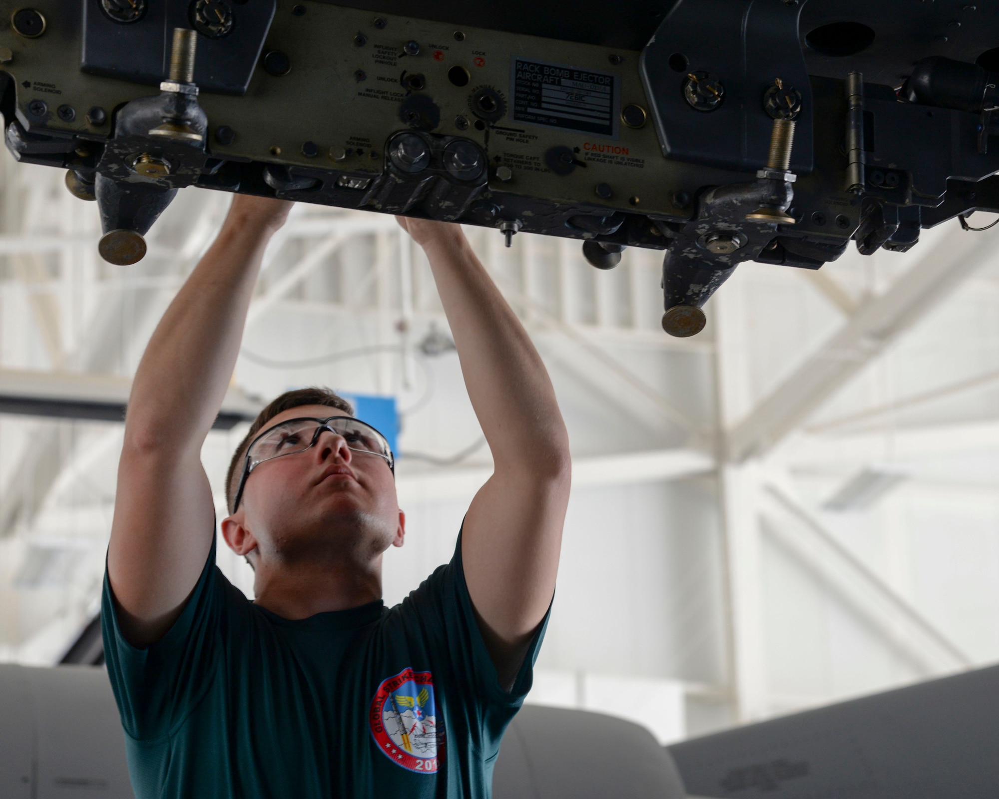 Airman 1st Class David Botterill, 2nd Aircraft Maintenance Squadron conventional load team, inspects a loading station during the 2015 Global Strike Challenge at Barksdale Air Force Base, La., Aug. 31. The Global Strike Challenge is the world's premier bomber, Intercontinental Ballistic Missile and security forces competition with units from Air Force Global Strike Command, Air Combat Command, Air Force Materiel Command, Air Force Reserve Command and the Air National Guard. (U.S. Air Force photo/Senior Airman Jannelle Dickey)