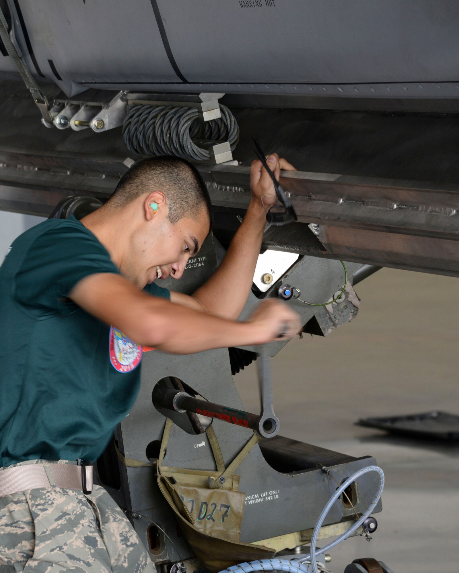 Airman 1st Class Michael Ruiz, 2nd Aircraft Maintenance Squadron conventional load team, tilts a jammer into position for loading an AGM-158 during the 2015 Global Strike Challenge at Barksdale Air Force Base, La., Aug. 31. The time load consisted of a four-person team loading four AGM-158 Joint Air-to-Surface Standoff Missiles onto a B-52 Stratofortess. (U.S. Air Force photo/ Senior Airman Jannelle Dickey)