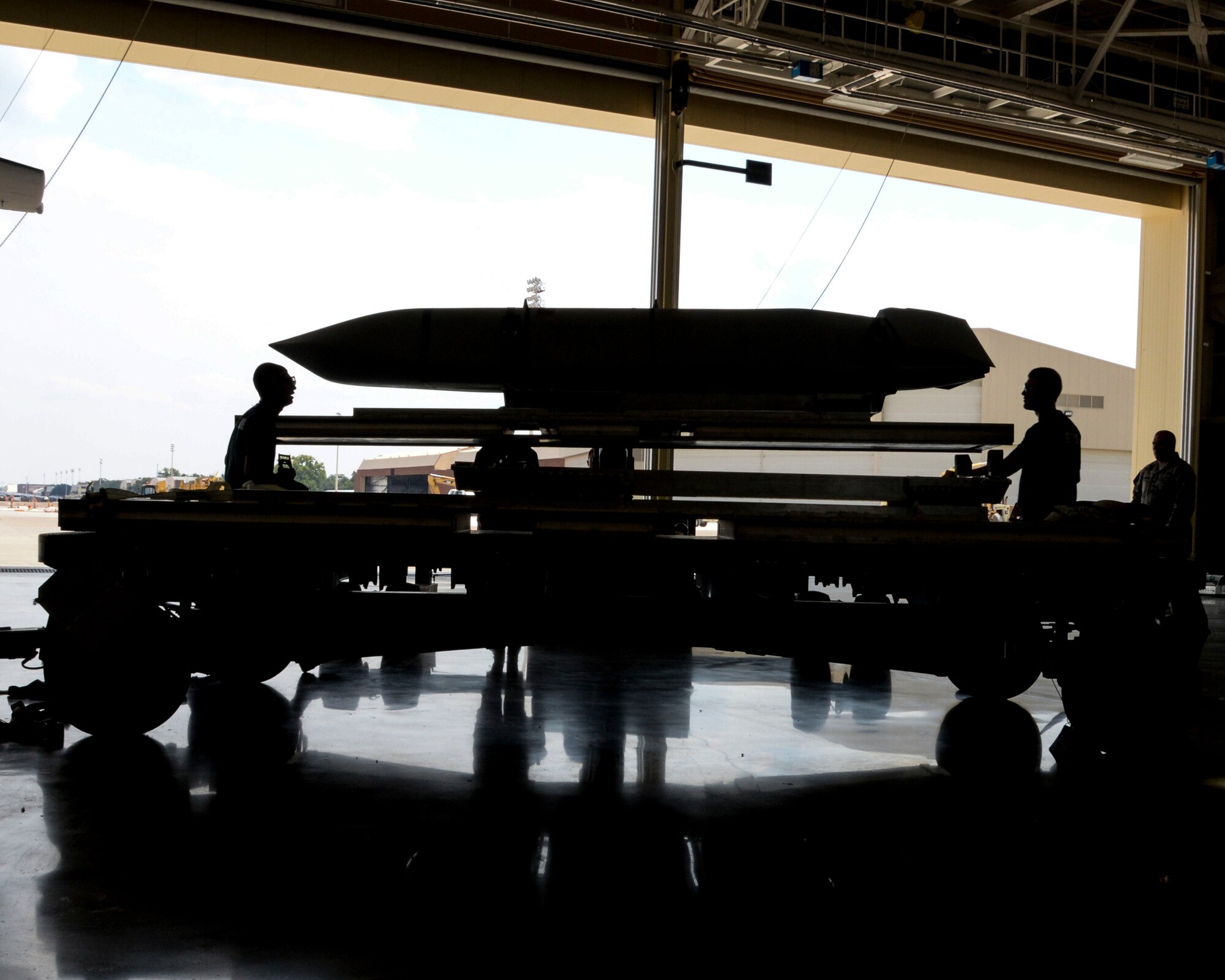 Airman 1st Class Michael Ruiz and Senior Airman Jeremy Pratta, 2nd Aircraft Maintenance Squadron conventional load team, oversee the lifting of an AGM-158 during the 2015 Global Strike Challenge at Barksdale Air Force Base, La., Aug. 31. The purpose of the challenge is to showcase the world's premier bomber force and foster esprit de corps through competition and teamwork. (U.S. Air Force photo/ Senior Airman Jannelle Dickey)