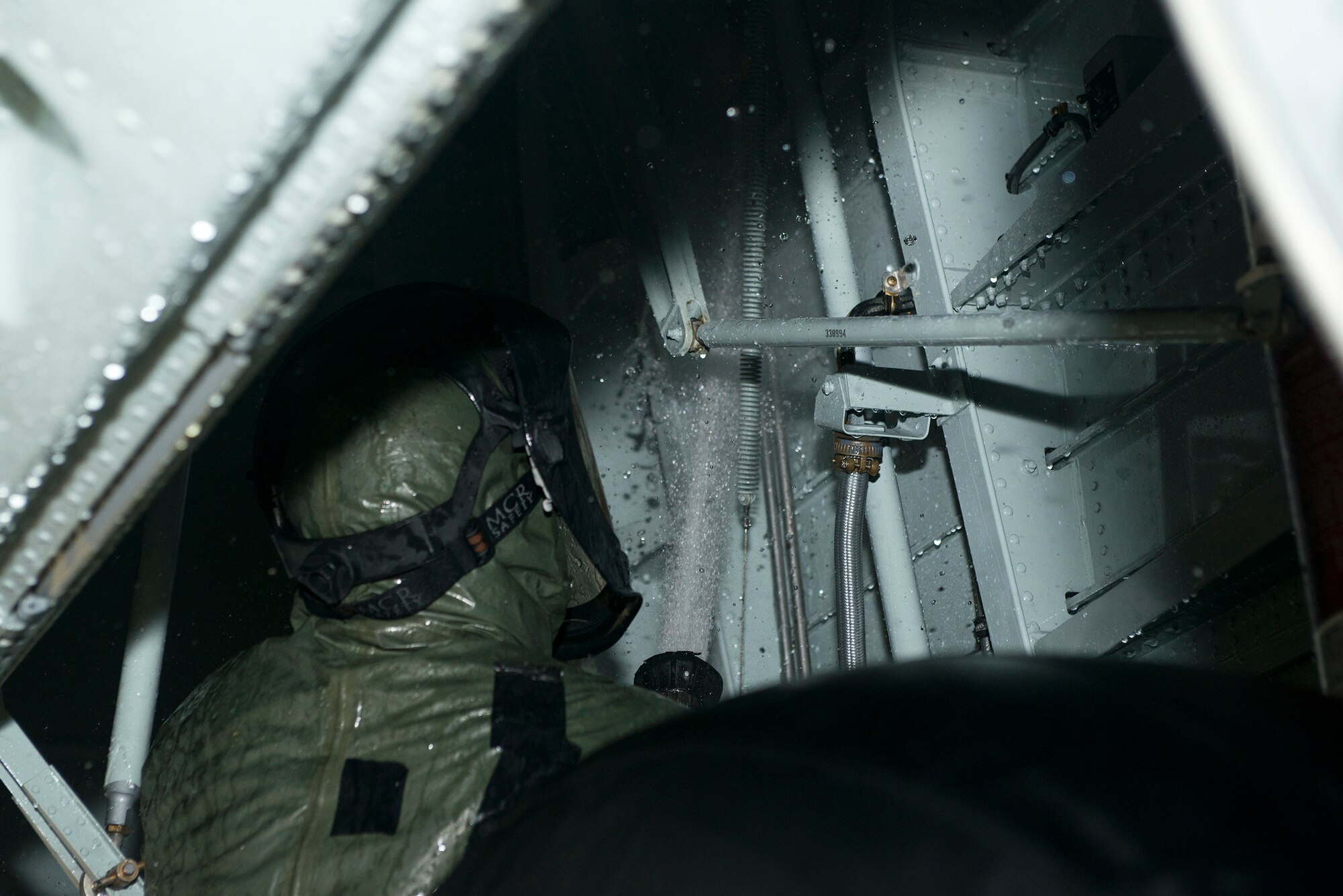 U.S. Air Force Airman 1st Class Cody Brown, 71st Rescue Squadron integrated flight control systems journeyman, sprays off the landing gear on an HC-130J Combat King II Sept. 1, 2015, at Moody Air Force Base, Ga. Cleaning an aircraft helps prevent corrosion and promotes efficiency while flying. (U.S. Air Force photo by Airman 1st Class Kathleen D. Bryant/Released)
