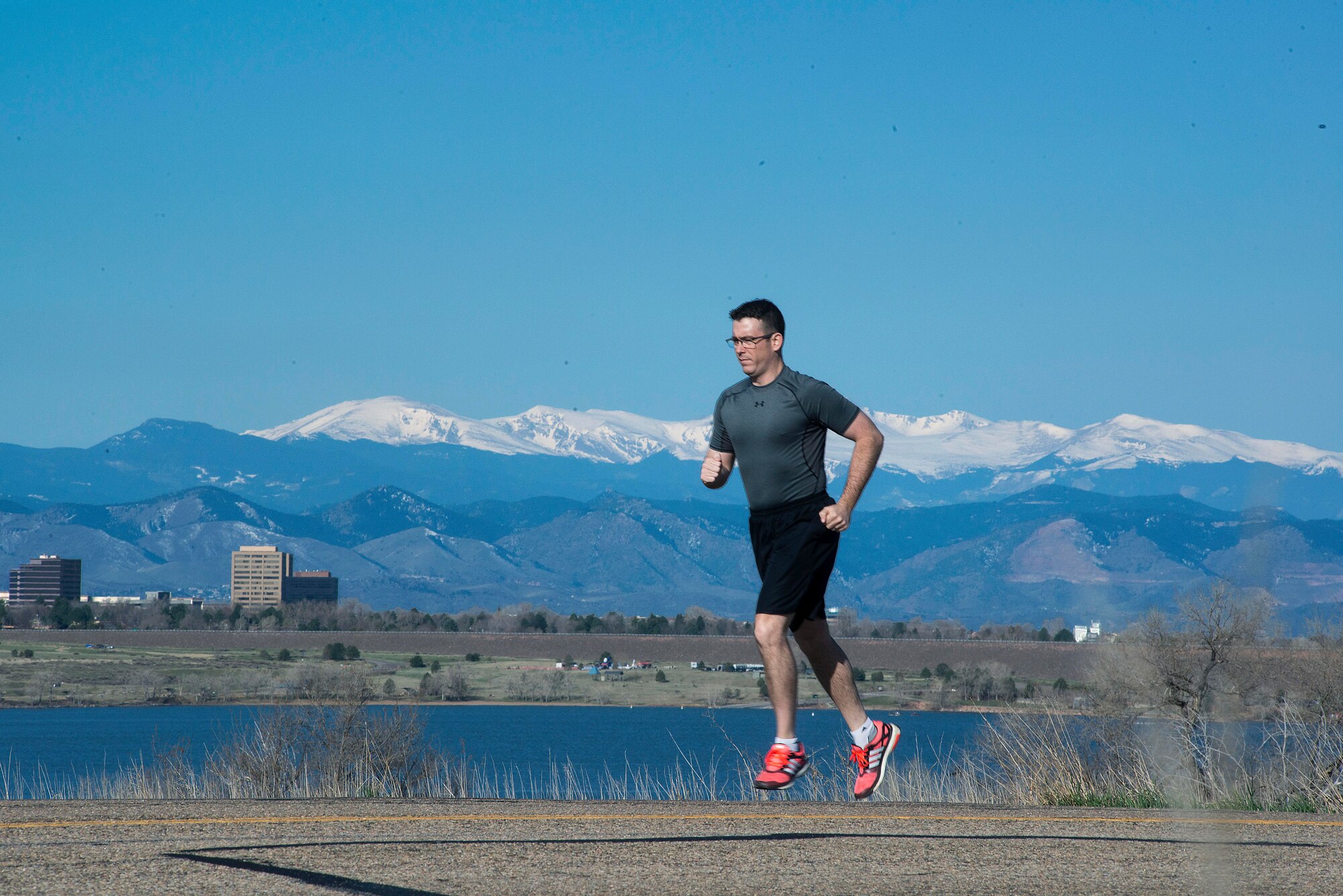 Mater Sgt. Troy Drasher, 460th Space Wing 2nd Space Warning Squadron first sergeant, runs marathons and half marathons to prepare for a run from Aurora, Colo., to Abilene, Texas, Sept. 2, 2015, in Aurora. Drasher is conducting Operation 720, a 720-mile run from Aurora to Abilene, in order to raise money and awareness for the Wounded Warrior Project. (U.S. Air Force photo by Senior Airman Riley Johnson/Released)