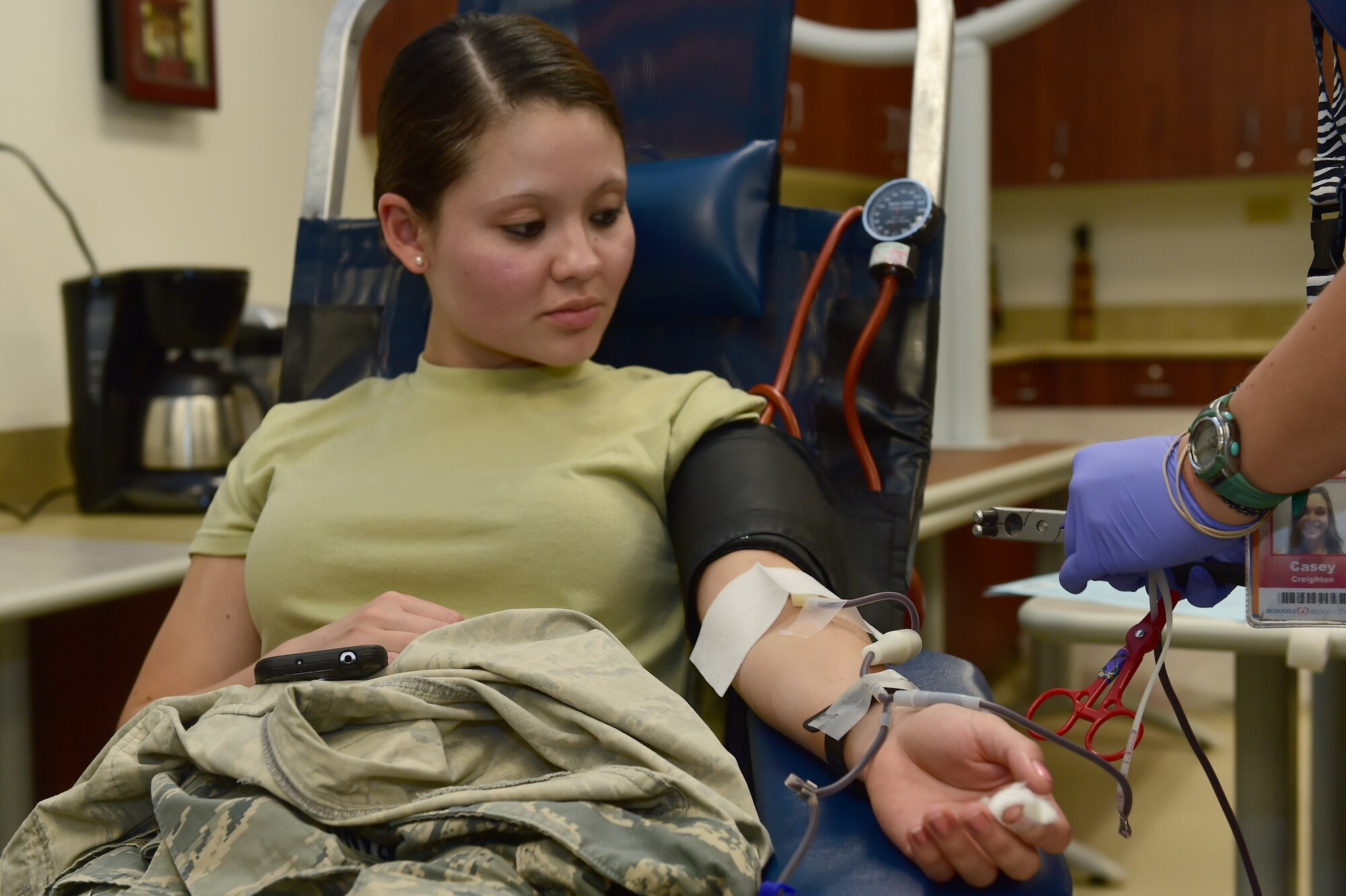 Airman 1st Class Cinthya Solorzano, 460th Space Wing 2nd Space Warning Squadron space operator, donates blood at the Health and Wellness Center during a blood drive hosted by Bonfils Blood Center Sept. 2, 2015, on Buckley Air Force Base, Colo. Team Buckley members participated in the drive to donate and raise awareness towards the donation of blood for those in need. (U.S. Air Force photo by Airman 1st Class Luke W. Nowakowski/Released)