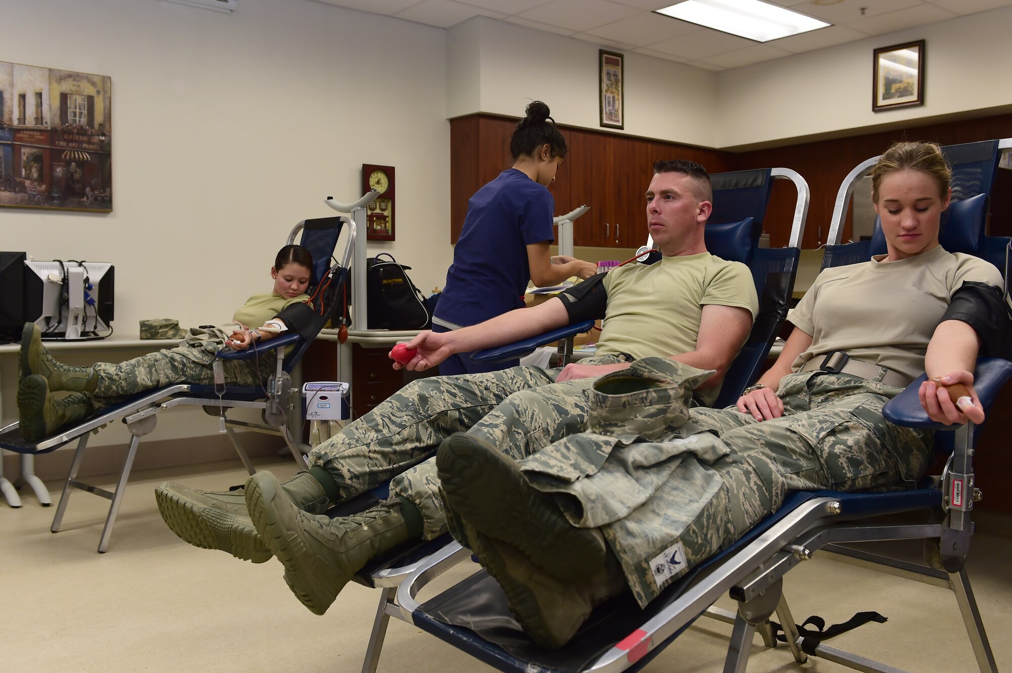 Team Buckley members donate blood during a blood drive hosted by Bonfils Blood Center Sept. 2, 2015, on Buckley Air Force Base, Colo. The blood drive is hosted to raise awareness and donations for those in need. (U.S. Air Force photo by Airman 1st Class Luke W. Nowakowski/Released)