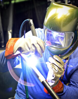 Lester Walker, with the 548th Propulsion Maintenance Squadron, performs a weld on a titanium tube. Mr. Walker trains welders from all across the Air Force and the Air Force Reserves. After the welders have gone through their training, a third-party Certified Welding Inspector verifies their work. (Air Force photo by Kelly White/Released)