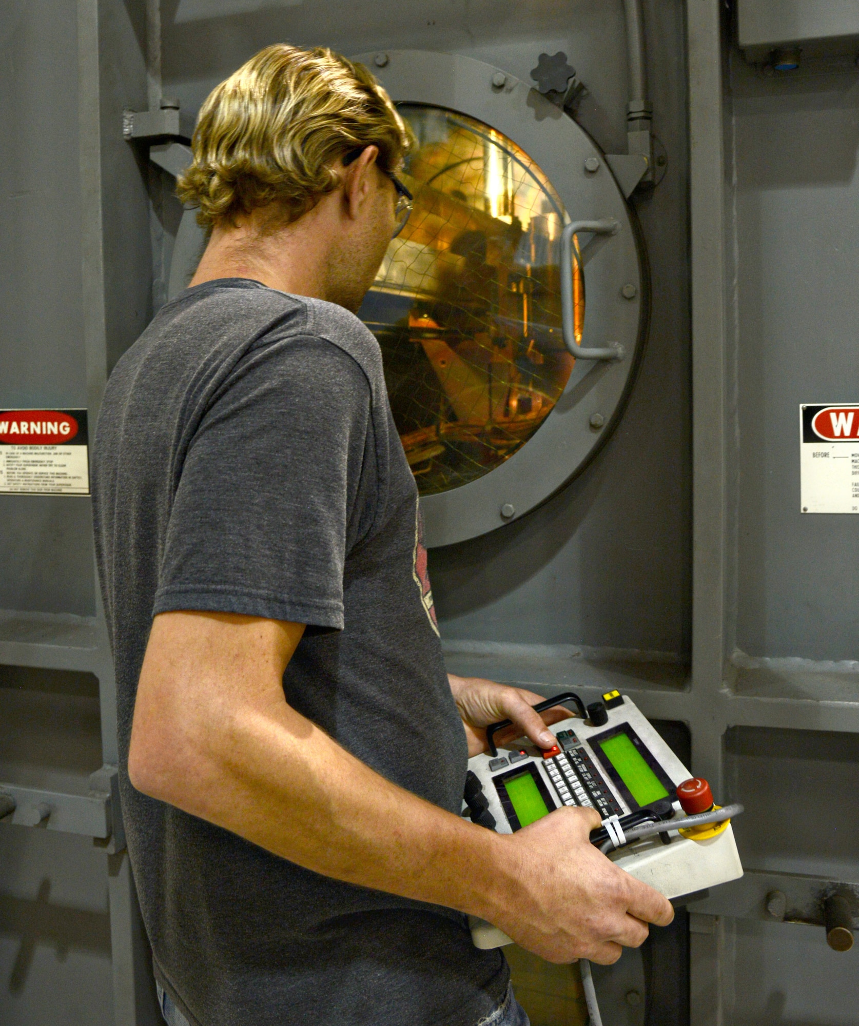 Matt Michaels, an elite welder in the 545th Propulsion Maintenance Group, is one of two people on base certified to work on the electron beam welder, a machine that fusion welds parts in a vacuum chamber. The machine can weld metals from paper-thin to 1 1/2-foot thick -- mainly stainless steel and titanium, but is capable of welding all alloys. (Air Force photo by Kelly White/Released)