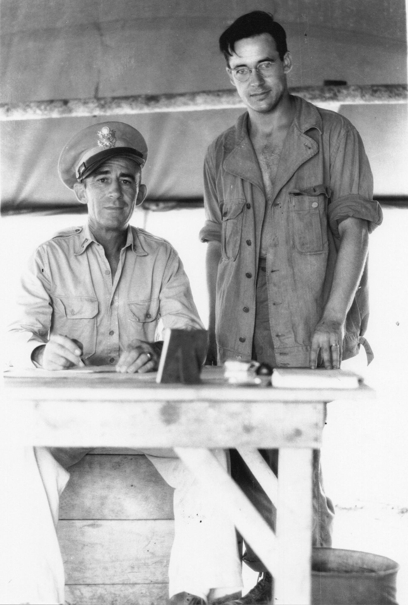 Sgt. Fred H. Hill, 17th Reconnaissance Squadron (Bombardment), stands by 1st Lt. John P. O'Keefe, assigned to a Military Police unit, on Biak Island in 1944.  O’Keefe was the original First Sergeant of the 123rd Observation Squadron before being selected for Officer Candidate School during the war.  (Courtesy Mr. Fred Hill)