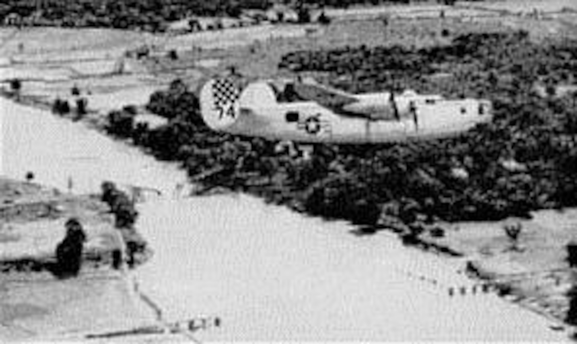 123rd Observation Squadron charter member Lt. Cliff Shaffer flew as a navigator in the 7th Bomb Group’s 436th Bomb Squadron.  Here a 436BS B-24 Liberator heavy bomber flies over two bridges across the Bilin River dropped by bombers at Bilin, Burma, which disrupted a key line of communication between Japanese forces in Burma and Thailand.   (U.S. Air Force) 