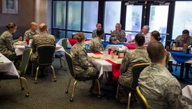 Maj. Gen. Frederick H. Martin, U.S. Air Force Expeditionary Center commander, Joint Base McGuire-Dix-Lakehurst, New Jersey, talks with Airmen and Sailors during a breakfast meeting Sep. 1, 2015, at the Gaylor dining facility on Joint Base Charleston, S.C. The U.S. Air Force Expeditionary Center is the Air Force's Center of Excellence for advanced expeditionary combat support training and education, while also providing direct oversight for en route and installation support, contingency response and partner capacity building mission sets within the global mobility enterprise. The Expeditionary Center provides operational control of the Expeditionary Operations School and administrative control for six wings and two groups within Air Mobility Command. (U.S. Air Force photo/Airman 1st Class Clayton Cupit)
