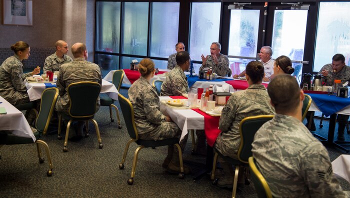 Maj. Gen. Frederick H. Martin, U.S. Air Force Expeditionary Center commander, Joint Base McGuire-Dix-Lakehurst, New Jersey, talks with Airmen and Sailors during a breakfast meeting Sep. 1, 2015, at the Gaylor dining facility on Joint Base Charleston, S.C. The U.S. Air Force Expeditionary Center is the Air Force's Center of Excellence for advanced expeditionary combat support training and education, while also providing direct oversight for en route and installation support, contingency response and partner capacity building mission sets within the global mobility enterprise. The Expeditionary Center provides operational control of the Expeditionary Operations School and administrative control for six wings and two groups within Air Mobility Command. (U.S. Air Force photo/Airman 1st Class Clayton Cupit)