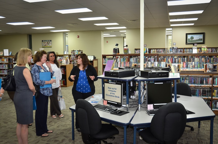 (Right) Angela Aschenbrenner, Joint Base Charleston Libraries director, gives a tour to Barbara Martin, wife of Maj. Gen. Frederick Martin, commander of the U.S. Air Force Expeditionary Center, during a base visit, Sept. 2, 2015 at Joint Base Charleston – Weapons Station, S.C. The purpose of the visit was to provide an overview of the library services available on the joint base. (U.S. Air Force photo/Staff Sgt. AJ Hyatt)