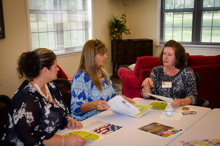(Right) Barbara Martin, wife of Maj. Gen. Frederick Martin, commander of the U.S. Air Force Expeditionary Center, receives a brief from Support Agencies at the Forest City Community Center during a base visit, Sept. 1, 2015 at Joint Base Charleston – Air Base, S.C. The purpose of the visit to Forest City Community Center was to receive in depth information on the unique housing relationships on the Air Base as well as details on local schools, Military Family Life Consultants and the Palmetto Scholars Academy. (U.S. Air Force photo/Staff Sgt. AJ Hyatt)