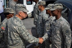 Maj. Gen. Frederick H. Martin, U.S. Air Force Expeditionary Center commander, Joint Base McGuire-Dix-Lakehurst, New Jersey, meets with soldiers from the 841st Transportation Battalion during a base visit, Sept. 2, 2015 at Joint Base Charleston – Weapons Station, S.C. Martin was accompanied by Brig. Gen. James Scanlan, Mobilization Assistant to the commander of the U.S. Air Force Expeditionary Center, and John Hood, honorary commander of the U.S. Air Force Expeditionary Center. The U.S. Air Force Expeditionary Center is the Air Force's Center of Excellence for advanced expeditionary combat support training and education, while also providing direct oversight for en route and installation support, contingency response and partner capacity building mission sets within the global mobility enterprise. The Expeditionary Center provides operational control of the Expeditionary Operations School and administrative control for six wings and two groups within Air Mobility Command. The visit to the 841st was one of many stops Maj. Gen. Martin made to JB Charleston mission partners. Next week's edition of the Patriot will have additional coverage of his visit  (Air Force photo/Staff Sgt. AJ Hyatt) 
