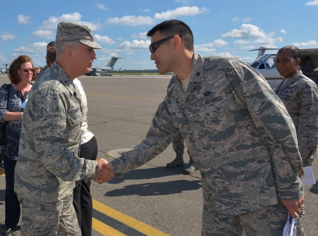(From left to right) Maj. Gen. Frederick Martin, U.S. Air Force Expeditionary Center commander, Joint Base McGuire-Dix-Lakehurst, NJ, greets with Maj. Woo Suk Chun, 628th Civil Engineer Squadron operations flight commander, Joint Base Charleston, SC, on the flight line at JB Charleston, SC, Sept. 1, 2015. Martin was accompanied by his wife, Barbara, Brig. Gen. James Scanlan, Mobilization Assistant to the commander of the U.S. Air Force Expeditionary Center, John Hood, honorary commander of the U.S. Air Force Expeditionary Center and Chief Master Sgt. Peter Stone, U.S. Air Force. EC command chief. During his visit, Martin toured various locations across the Air Base and Weapons Station where he was able to interact with several of Joint Base Charleston’s Mission Partners. The U.S. Air Force Expeditionary Center is the Air Force's Center of Excellence for advanced expeditionary combat support training and education, while also providing direct oversight for en route and installation support, contingency response and partner capacity building mission sets within the global mobility enterprise. (U.S. Air Force photo/Airman 1st Class Thomas T. Charlton)