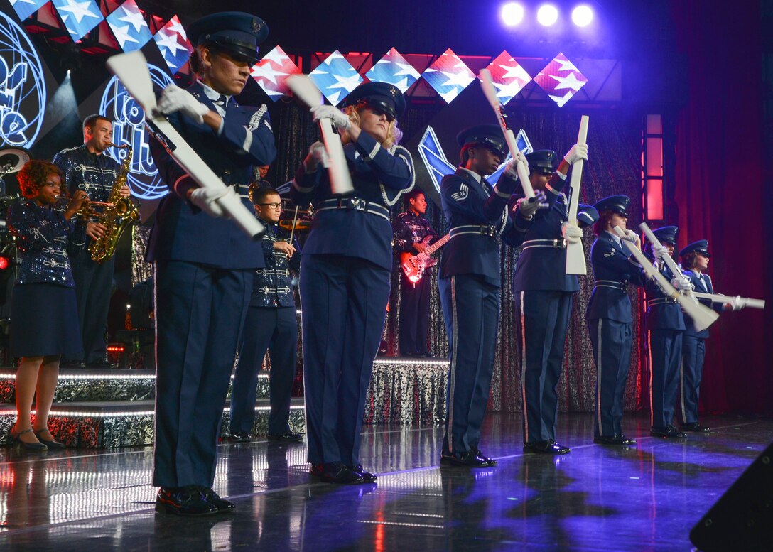 U.S. Air Force Airmen from Tops in Blue perform a rifle drill during the 2015 Tops in Blue World Tour Aug. 28, 2015, at the Abilene Civic Center in Abilene, Texas. This year’s theme is “Freedom’s Song,” a celebration of the freedoms we enjoy as Americans. (U.S. Air Force photo by Senior Airman Kedesha Pennant/Released)