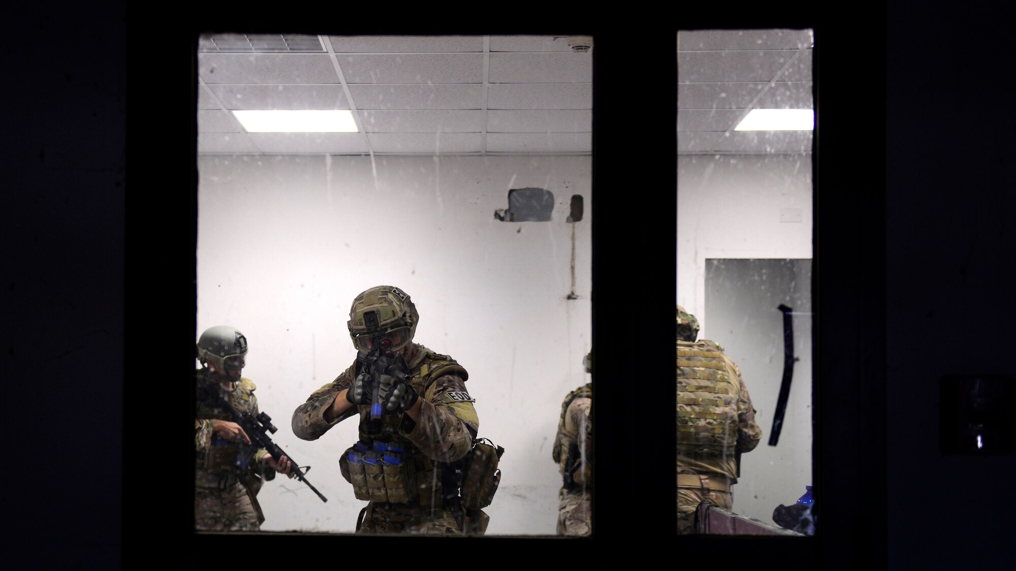 U.S. Air Force Airmen assigned to the 31st Civil Engineer Squadron Explosive Ordnance Disposal flight, participate in close quarters battle training, Sept. 1, 2015 at Aviano Air Base, Italy. The training included classroom instruction and a hands-on portion where the participants learned how to work as a team in a close quarters battle environment, how to handle weapons safely among others, individual shooting fundamentals and shooting with opposing force. (U.S. Air Force photo by senior Airman Areca T. Wilson/Released)