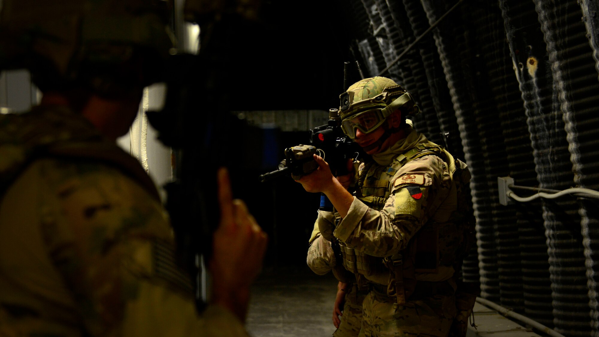 U.S. Air Force Senior Airman Joshua Hill, 31st Civil Engineer Squadron Explosive Ordnance Disposal journeyman, participates in close-quarters battle training, Sept. 1, 2015 at Aviano Air Base, Italy. The training included classroom instruction and a hands-on portion where the participants learned how to work as a team in a close-quarters battle environment. (U.S. Air Force photo by senior Airman Areca T. Wilson/Released)